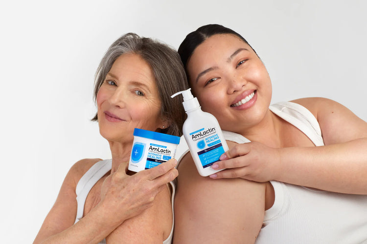 Older female and younger Asian female holding AmLactin Intensive Healing Cream & Lotion