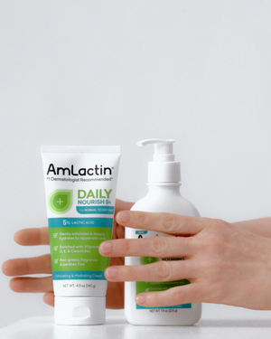 Hands holding AmLactin Daily Nourish 5% Cream and Lotion