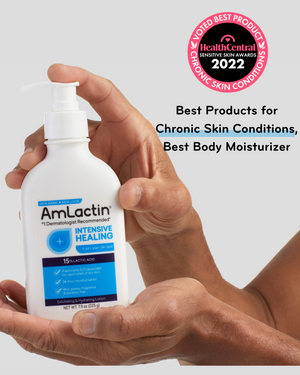 pair of hands holding AmLactin 7.9 oz bottle with HealthCentral Chronic Skin Conditions Best Product Sensitive Skin Awards 2022 Badge