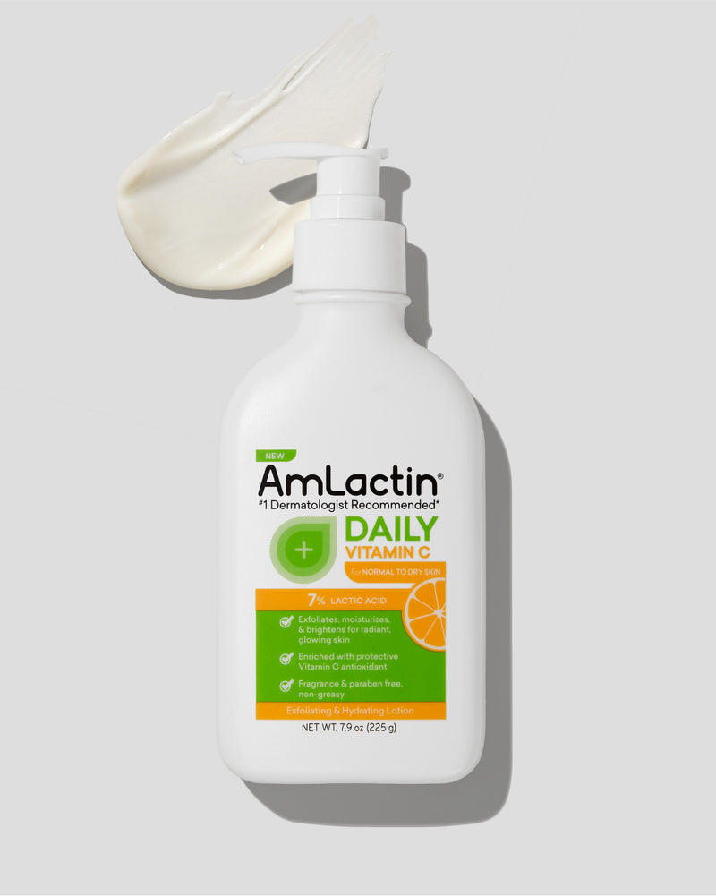 AmLactin Daily Vitamin C 7% Lotion 7.9 oz Pump Top Bottle on light grey background with shadow. Lotion swatch near pump top at top left corner of image.