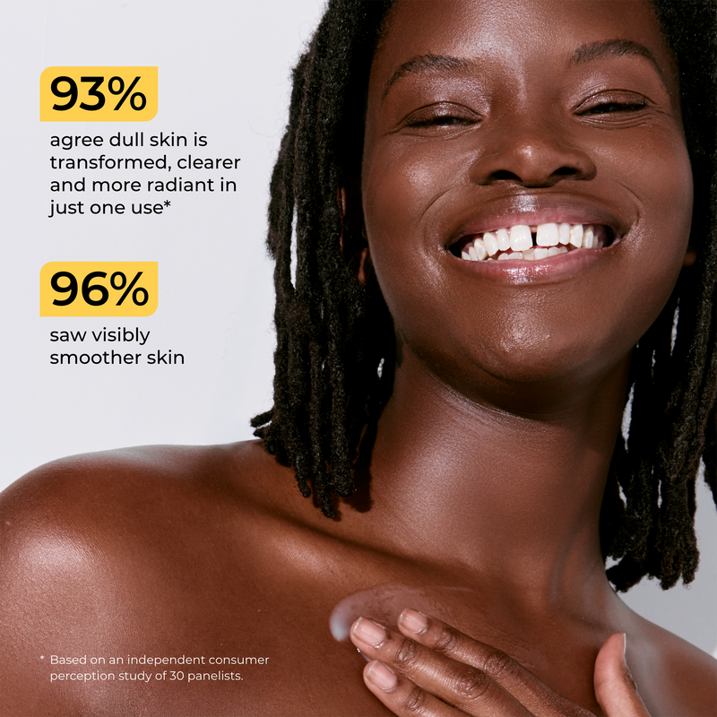 A smiling woman with dark skin and dreadlocks is shown from the shoulders up against a light gray background, with two yellow text callouts on the left reading '93% agree dull skin is transformed, clearer and more radiant in just one use*' and '96% saw visibly smoother skin'.