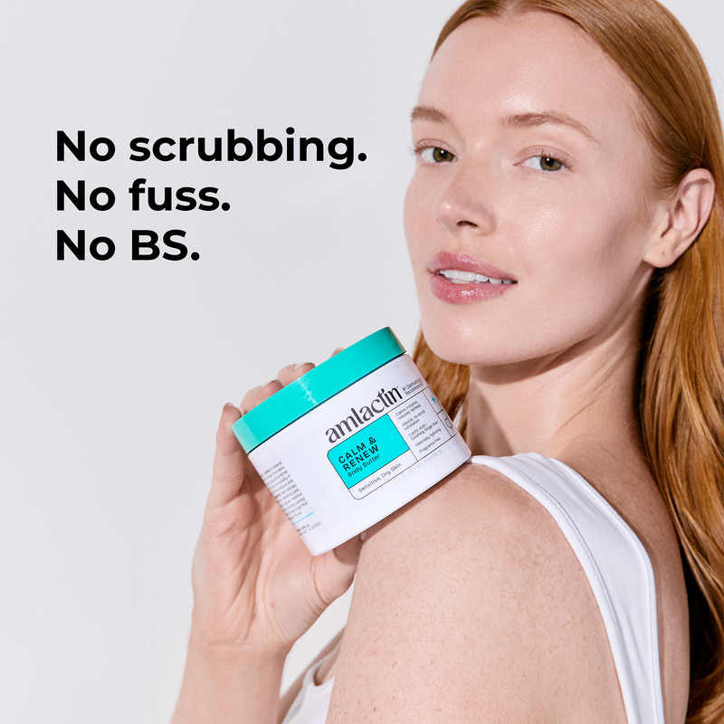 A woman with red hair holds a jar of amlactin Calm & Renew Body Butter against a light gray background, with the text 'No scrubbing. No fuss. No BS.'