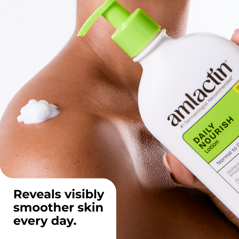 A close-up of a person's shoulder and upper arm with a dollop of white lotion on the skin, holding an amlactin Daily Nourish lotion bottle with a bright green pump. A text overlay at the bottom left reads, 'Reveals visibly smoother skin every day.