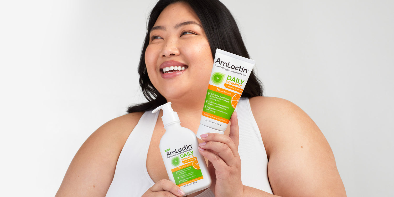 Asian female holding AmLactin Daily Vitamin C Cream & Lotion