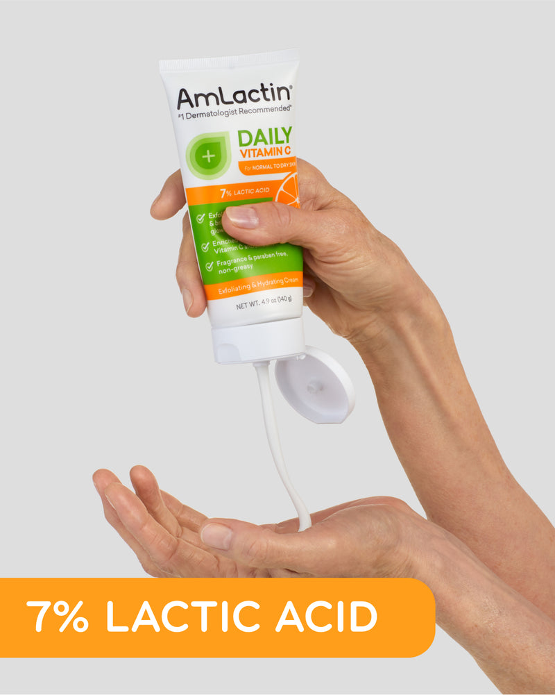 Older woman's hand squeezing 4.9 oz tube of AmLactin Daily Vitamin C 7% Cream into the palm of her other hand. 7% Lactic Acid callout flag in orange on bottom of image.